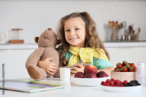 Cute little girl with teddy...