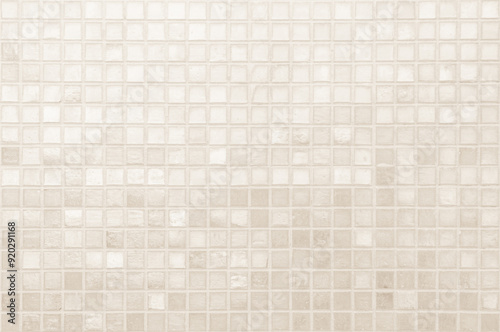 Cream light ceramic wall and floor tiles mosaic background in bathroom and kitchen. Design pattern geometric with grid wallpaper texture decoration pool. Simple seamless abstract surface clean. photo