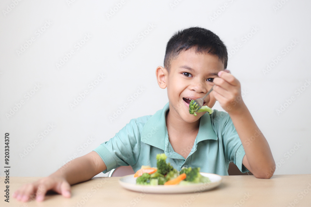 Nutrition healthy eating habits for kids concept. Children do not like to eat vegetables. Little cute boy refuses to eat healthy vegetables. Nutrition healthy eating habits for kids concept. Children do not like to eat vegetables. Little cute boy refuses to eat healthy vegetables.