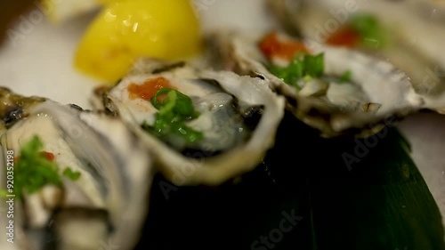 Fresh Oysters with Lemon Garnish photo