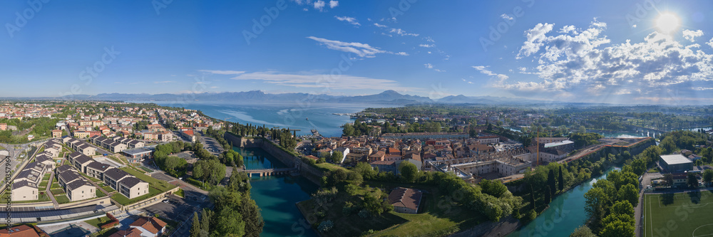 Aerial panorama on the lake. Aerial view of the town of Peschiera del Garda located on the shores of Lake Garda. Resorts on Lake Garda Italy. City on the water Italy. The largest lake in Italy. Aerial panorama on the lake. Aerial view of the town of Peschiera del Garda located on the shores of Lake Garda. Resorts on Lake Garda Italy. City on the water Italy. The largest lake in Italy.