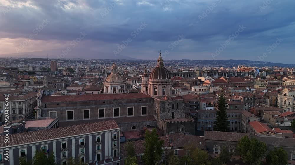 Scenic aerial view of Rome at sunset with historic buildings and dramatic sky Scenic aerial view of Rome at sunset with historic buildings and dramatic sky