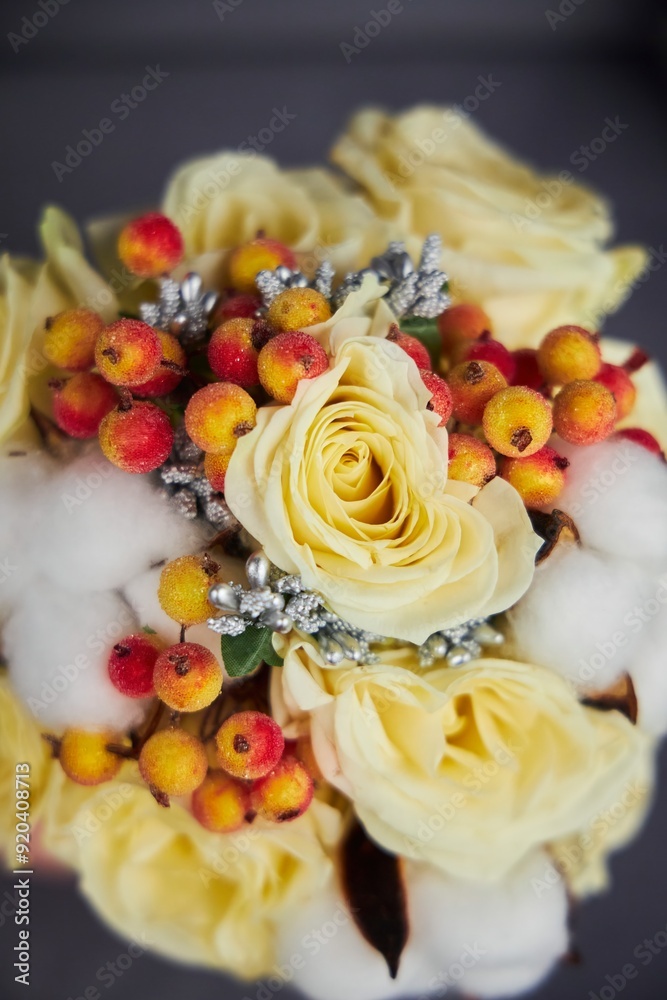 A bouquet of yellow flowers with a ring on top of each flower. The rings are silver and have diamonds on them. A bouquet of yellow flowers with a ring on top of each flower. The rings are silver and have diamonds on them.