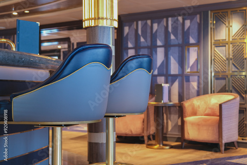 Luxurious observation or panorama lounge with floor to ceiling windows onboard cruiseship or cruise ship ocean liner with comfortable seating and amazing view photo