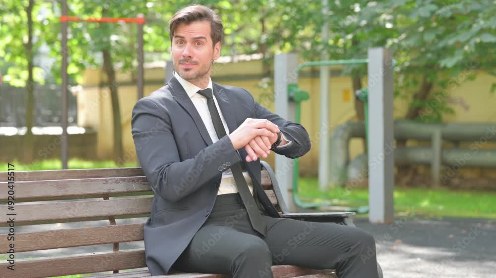 Young Businessman Waiting and Checking Time Outdoor Young Businessman Waiting and Checking Time Outdoor