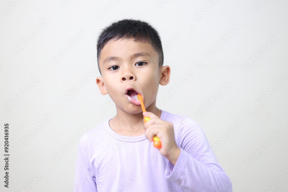child Asia kid boy brushing teeth isolated on white backgroud. child Asia kid boy brushing teeth isolated on white backgroud.