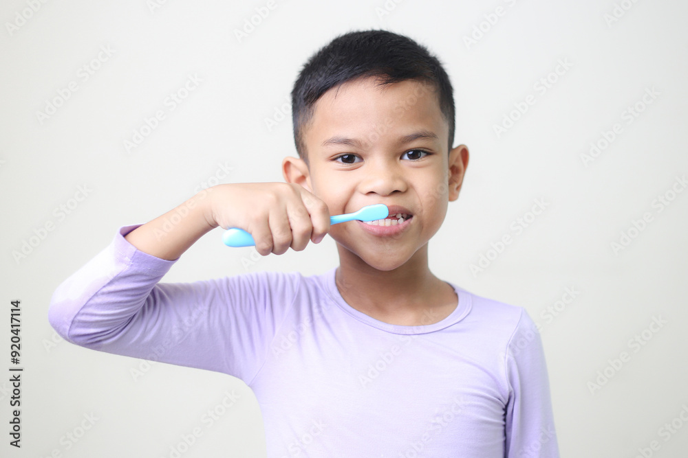 child Asia kid boy brushing teeth isolated on white backgroud. child Asia kid boy brushing teeth isolated on white backgroud.