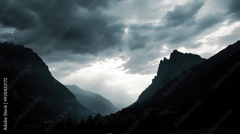 Sinister silhouette of looming mountains Sinister silhouette of looming mountains