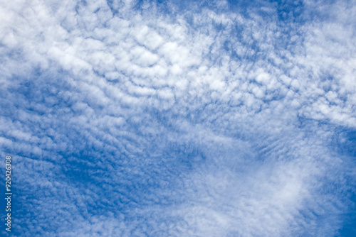 bright sky with fluffy clouds as a good weather background image