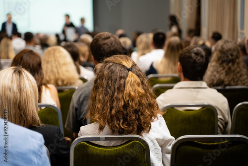 The audience is actively engaged during a conference setting designed for professional development and networking