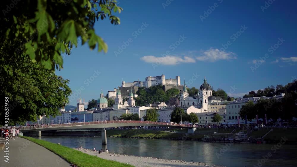 Revealing Salzburg Castle with Church towers in old town from river Revealing Salzburg Castle with Church towers in old town from river