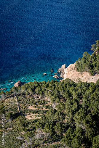 Banyalbufar in Mallorca - rocky cliffs on a summer day with blue water