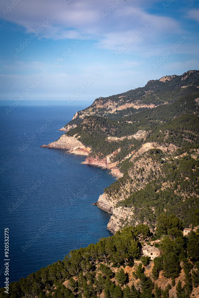 Banyalbufar in Mallorca - rocky cliffs on a summer day with blue water Banyalbufar in Mallorca - rocky cliffs on a summer day with blue water