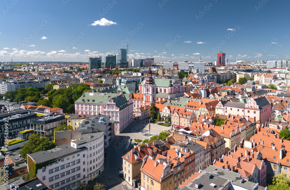 Summer skyline cityscape of Poznan (Poznań), Poland. Wide panoramic view of Plac Kolegiacki square and Basilica of Our Lady of Perpetual Help in Poznań Fara (Fara Poznańska)