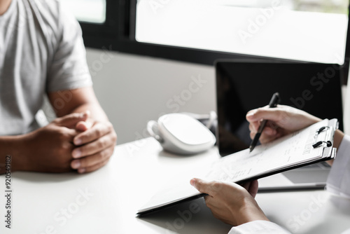 Female doctors who treat patients make an appointment to listen to the results after a physical examination and explain medical information and diagnose the disease. Medical concepts and good health
