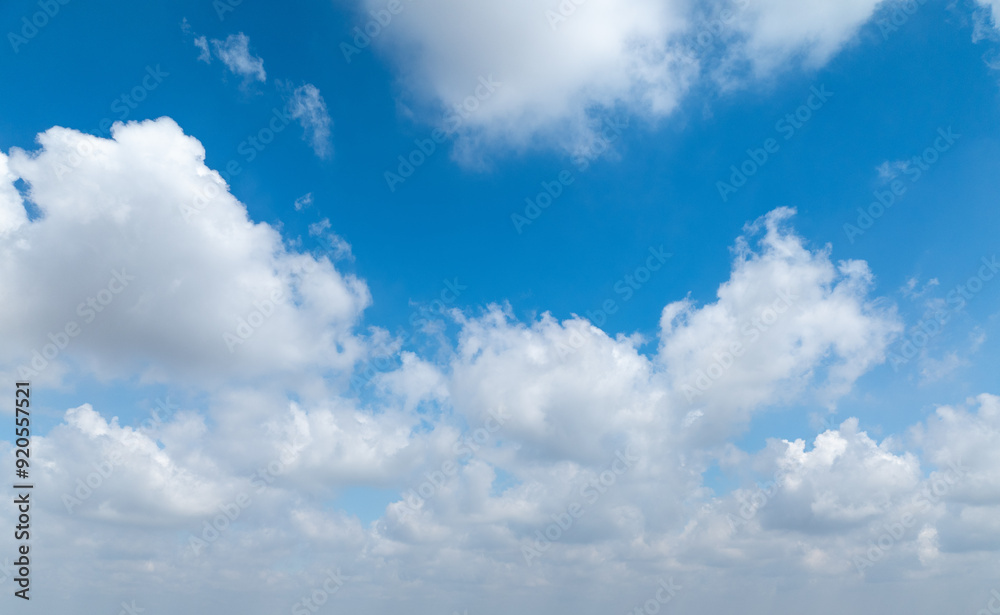Beautiful view of blue sky with clouds at sunrise. Partly cloudy. Colorful sunset. Natural sky background texture, beautiful color. Beautiful view of blue sky with clouds at sunrise. Partly cloudy. Colorful sunset. Natural sky background texture, beautiful color.