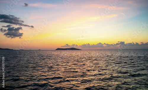 sunset over the island and sea photo