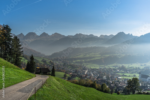 Village in Toggenburg with the Churfirsten mountains in background, Neu St. Johann, Canton of St. Gallen, Switzerland photo