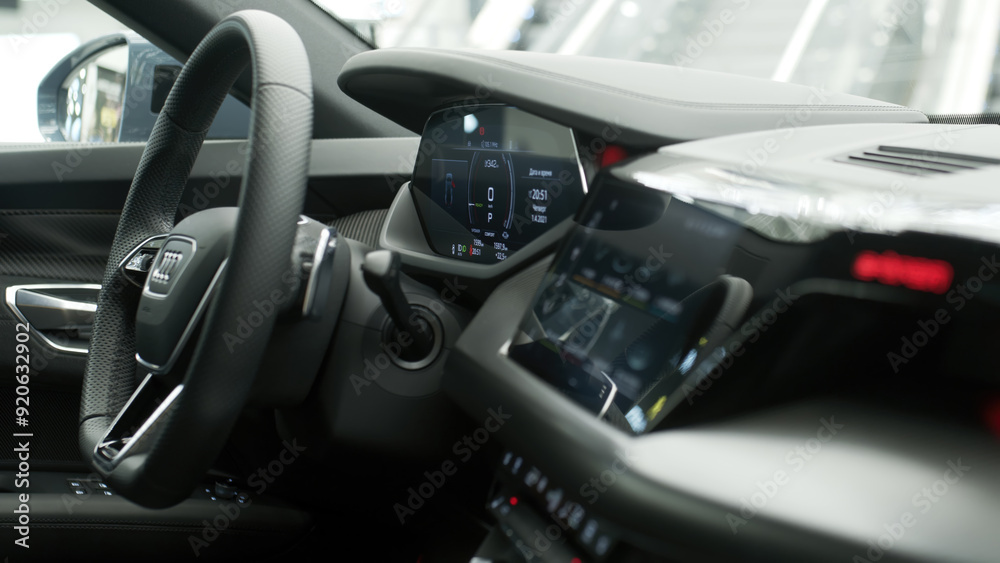 Close-up of a new electric car's interior, showcasing sleek design and cutting-edge technology. Perfect for highlighting modern automotive luxury and the future of eco-friendly transportation. Close-up of a new electric car's interior, showcasing sleek design and cutting-edge technology. Perfect for highlighting modern automotive luxury and the future of eco-friendly transportation.