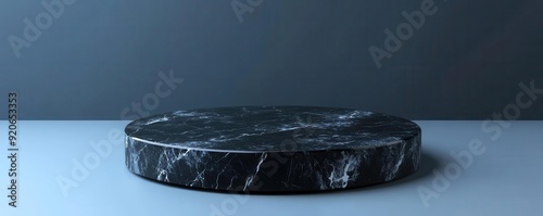 Sleek black marble pedestal on a cooltoned background, minimalism abstract, elegant 3D rendering photo