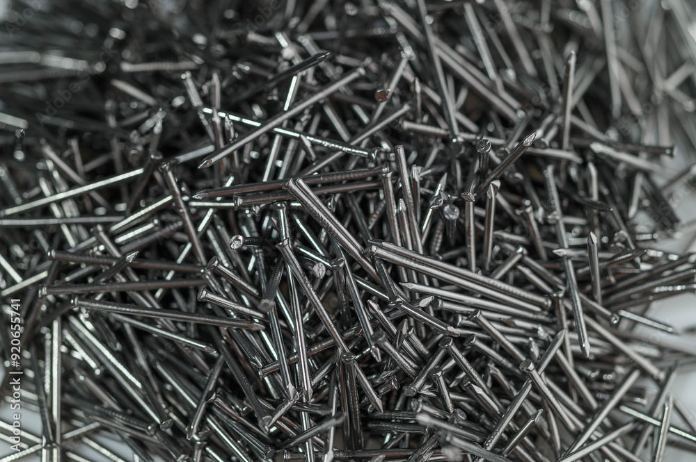 A pile of small iron nails as a background A pile of small iron nails as a background
