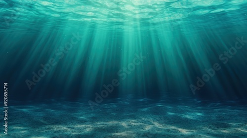 Sunlight Penetrating Through Clear Blue Ocean Water Creating Beautiful Underwater Scene with Rays of Light and Rippling Sand on the Ocean Floor