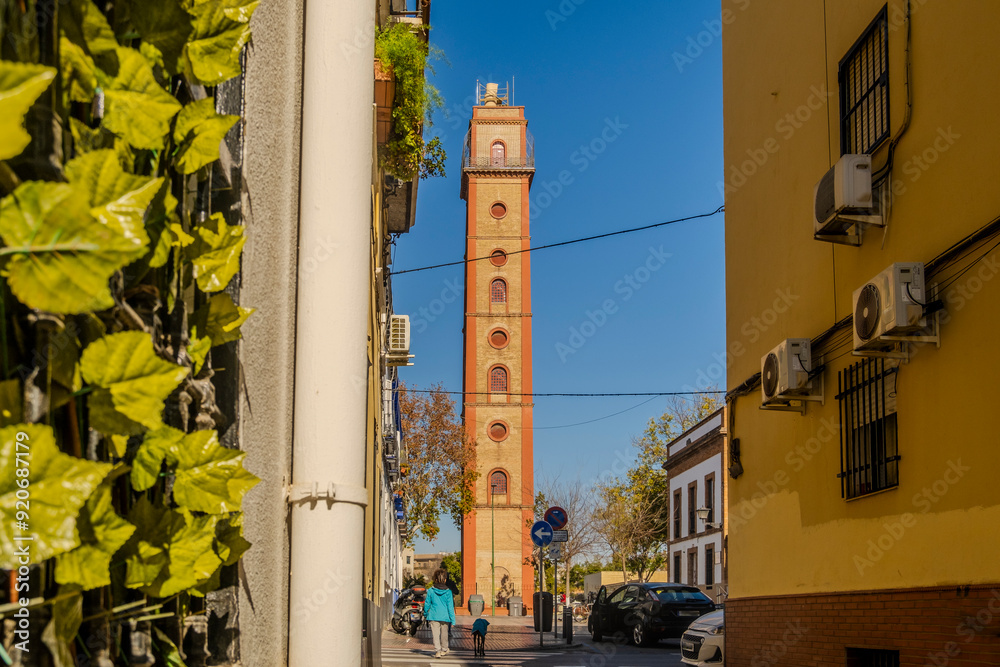 Charming street with view at historic Torre de los Perdigones in Seville, Andalusia, Spain