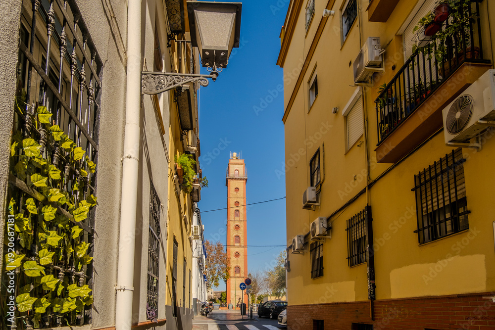 Charming street with view at historic Torre de los Perdigones in Seville, Andalusia, Spain