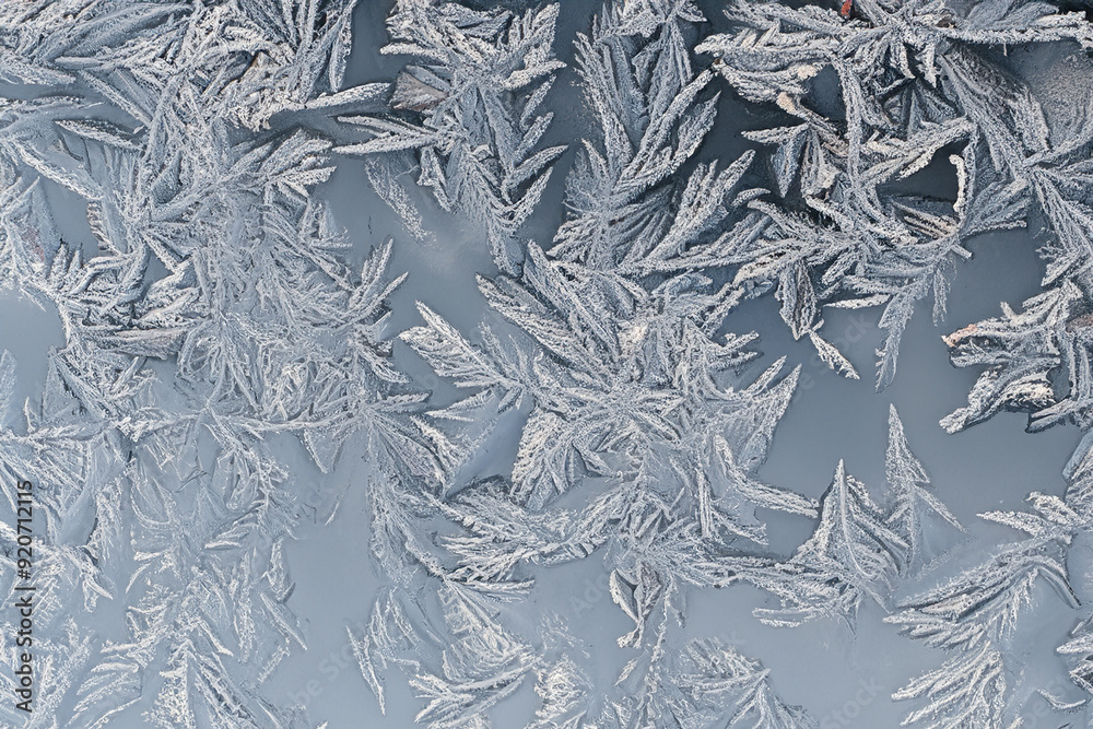 Frosted windows in the winter season. Crystal snow nature concept. Traces of frost on the glass of a window. Traces of frost on the glass in the winter season lifestyle. Frosted windows in the winter season. Crystal snow nature concept. Traces of frost on the glass of a window. Traces of frost on the glass in the winter season lifestyle.