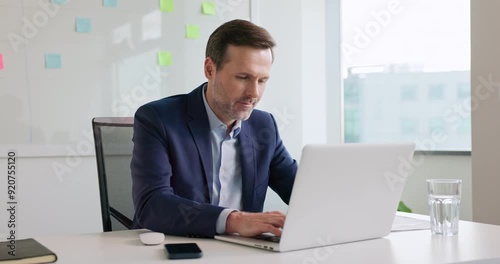 businessman working on laptop computer at modern office