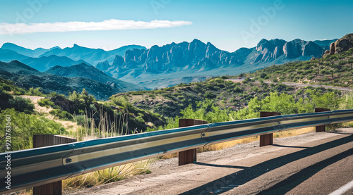 Industrial decay meets natural beauty, rusty guardrail with mountains in the background photo