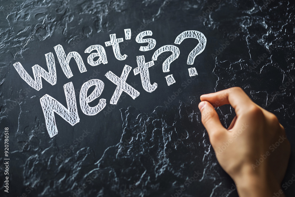 hand is writing the phrase 