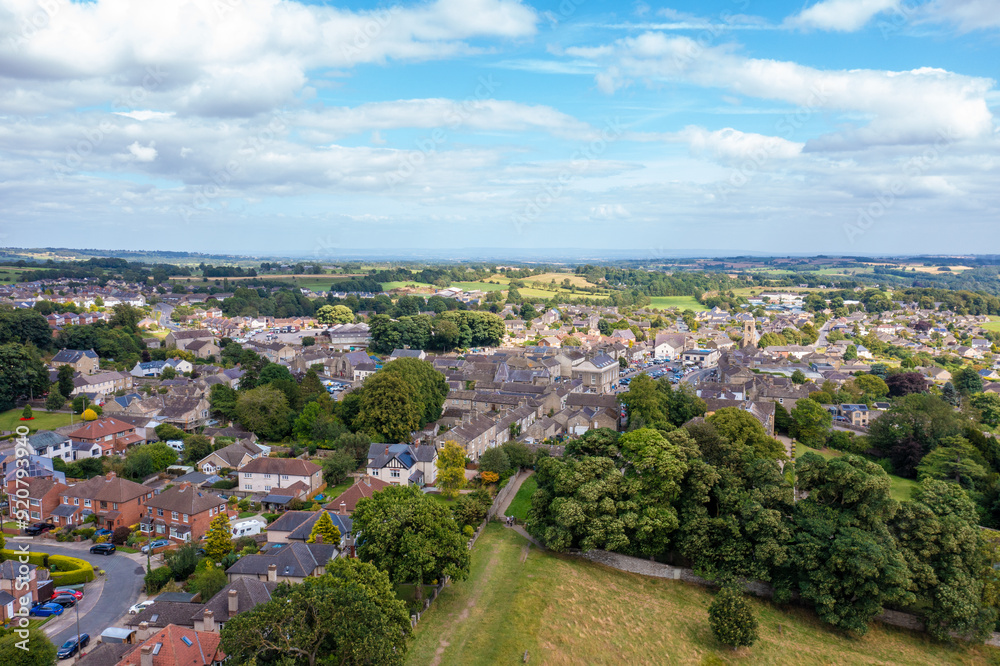 Aerial drone photo of the beautiful town of Leyburn which is a market town and civil parish in North Yorkshire in the UK, showing the houses in the town from above in the summer time