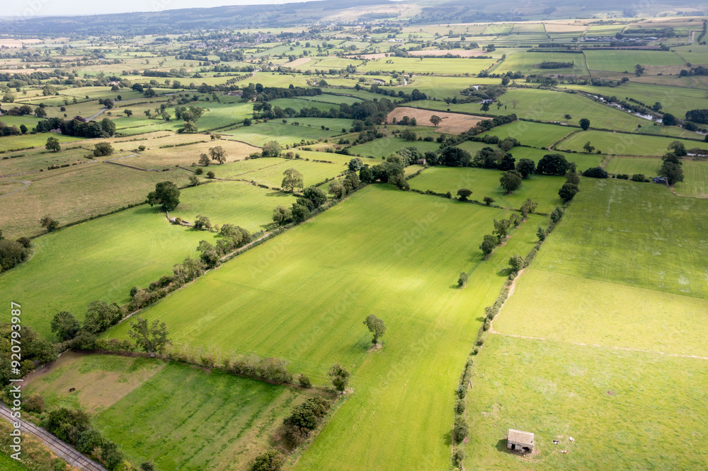 Aerial drone photo of the beautiful town of Leyburn which is a market town and civil parish in North Yorkshire in the UK, showing the houses in the town from above in the summer time