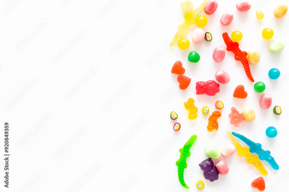Flat lay of colorful candies and lollipop. Sweet food and candies background