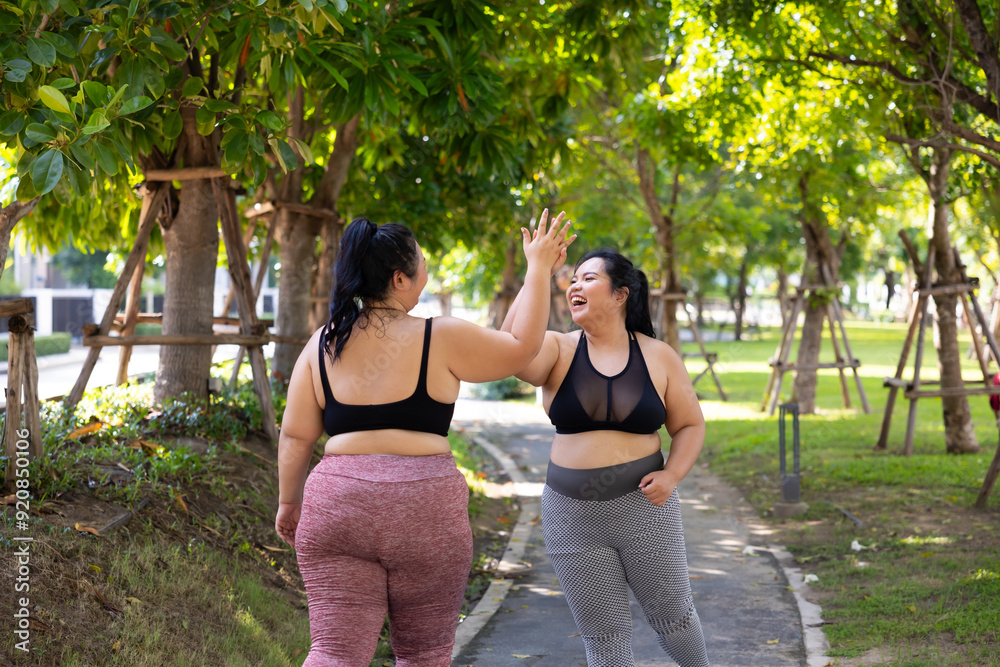 Fototapeta premium Bride Running outdoor woman. beautiful young chubby overweight woman in sportswear doing exercise outdoors at park. fitness sport club, body and health care. Activity