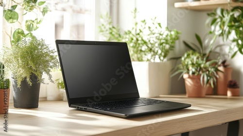 Wallpaper Mural Black laptop on desk surrounded by indoor plants
 Torontodigital.ca