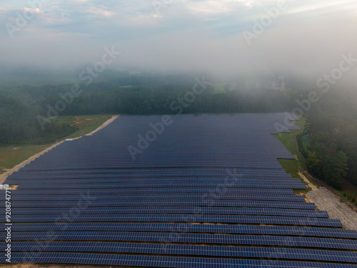 Morning Drone Images of a Large Renewable Solar Farm in Louisburg North Carolina Using Technology and Science for Green Energy & Lowering Carbon Footprints. 