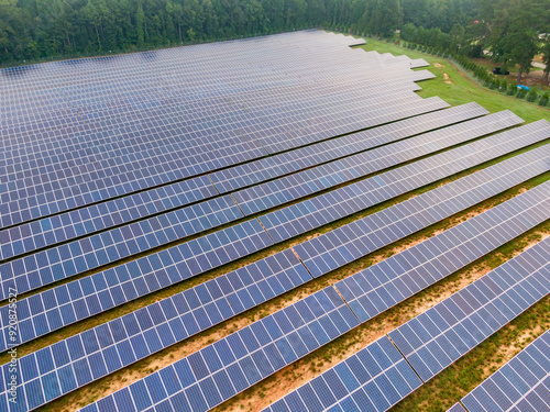 Morning Drone Images of a Large Renewable Solar Farm in Louisburg North Carolina Using Technology and Science for Green Energy & Lowering Carbon Footprints. 