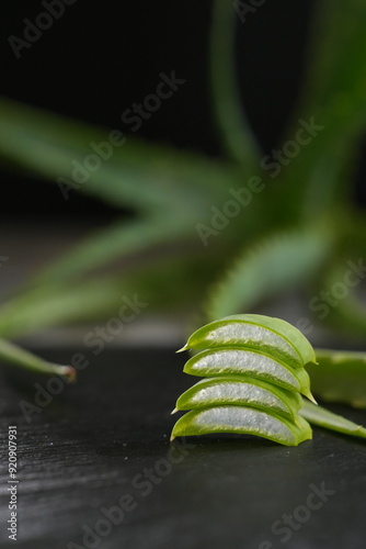 aloe vera lies on a black table