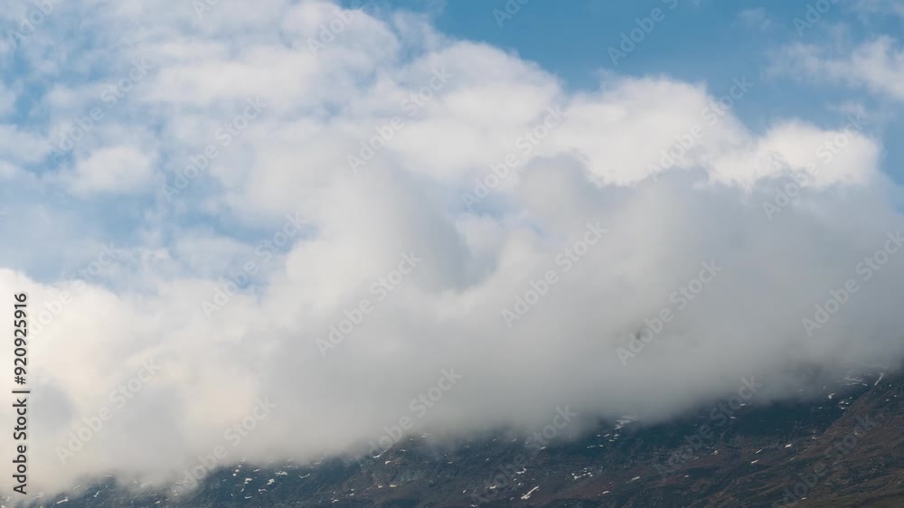 4K time lapse of rain clouds rolling over Seven Sister mountain peaks at Keylong in Lahaul, Himachal Pradesh, India. Dark monsoon clouds rolling over mountain peak. Scenic Nature landscape. 4K time lapse of rain clouds rolling over Seven Sister mountain peaks at Keylong in Lahaul, Himachal Pradesh, India. Dark monsoon clouds rolling over mountain peak. Scenic Nature landscape.