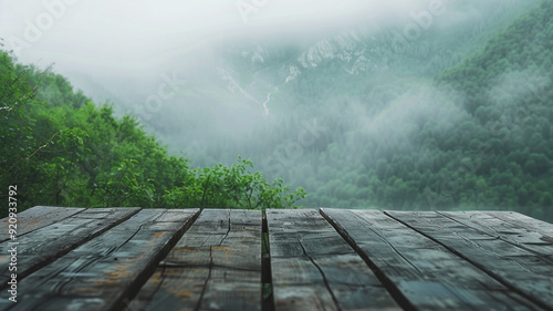 blank table on green mountain with mist on background