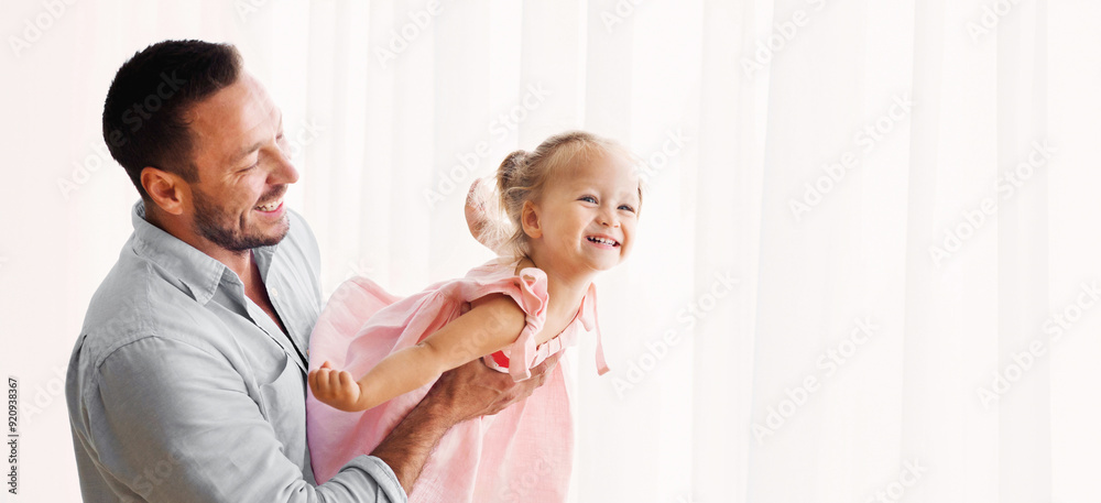Fototapeta premium Dad Lifting Little Girl Up, Daughter Flying, Having Fun Together. Panorama, empty space.
