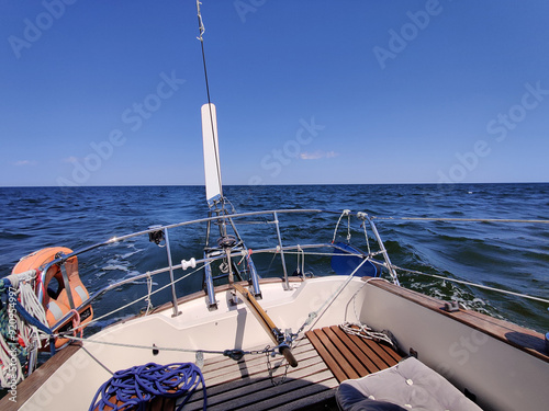 Fotografie Wind vane Monitor - wind autopilot on a stern of yacht sailing on a sunny summer