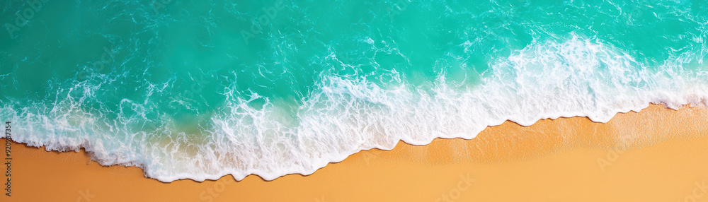 Aerial view of a beautiful sandy beach with turquoise ocean waves gently crashing along the shoreline, creating a scenic and serene coastal landscape. Aerial view of a beautiful sandy beach with turquoise ocean waves gently crashing along the shoreline, creating a scenic and serene coastal landscape.