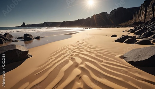 Fototapeta Naklejka Na Ścianę i Meble -  A captivating image of shimmering gold sand spread across a wide, open sand field, creating a sense of richness and vastness