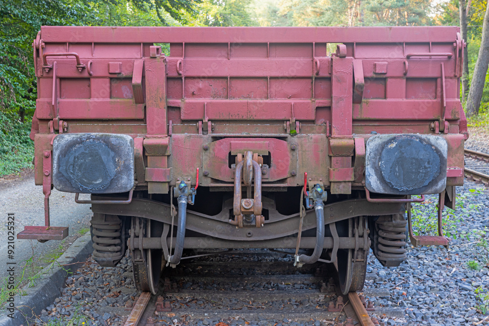Picture of an cargo railroad car standing on a track photographed from the ground perspective Picture of an cargo railroad car standing on a track photographed from the ground perspective
