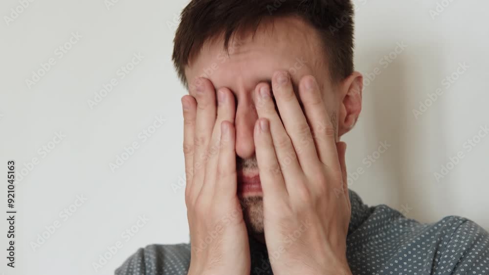 Portrait of caucasian man rubbing his face with palms close up. Getting yourself in order after waking up and facial massage after hard day. Portrait of caucasian man rubbing his face with palms close up. Getting yourself in order after waking up and facial massage after hard day.
