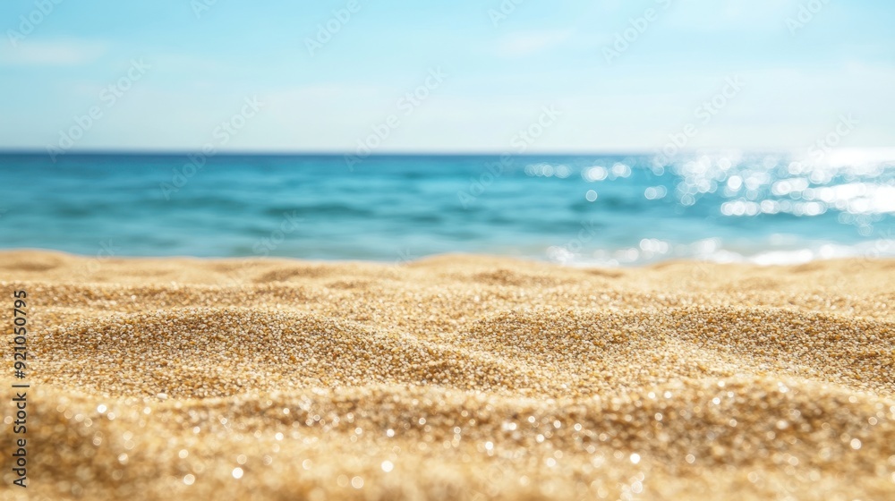 Close-up of Sandy Beach with Blurry Ocean in Background Close-up of Sandy Beach with Blurry Ocean in Background