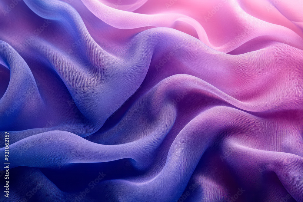 Obraz premium An abstract composition of blue and purple fabric billowing in the wind, with subtle shadows and highlights creating depth,